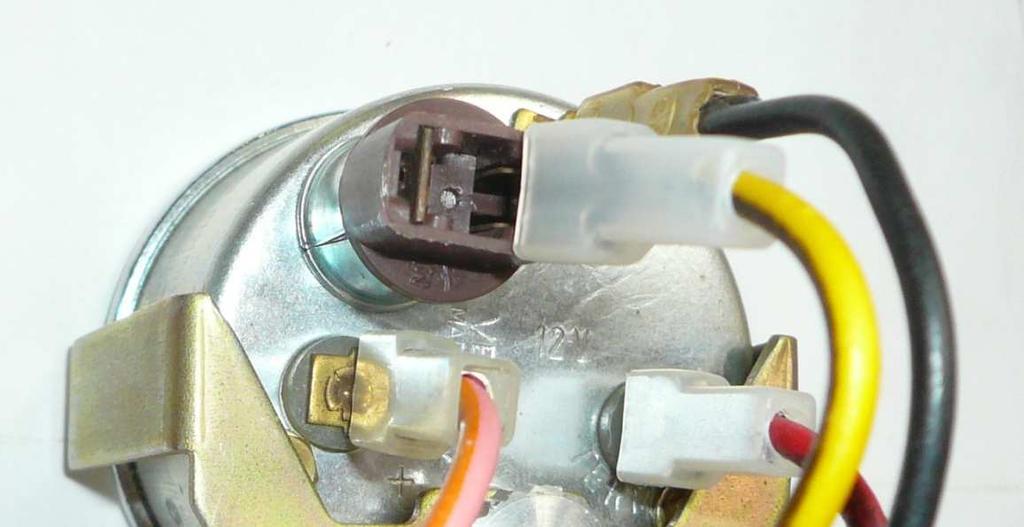 Removing factory light bulb Yellow wire Look for the brown lamp socket and