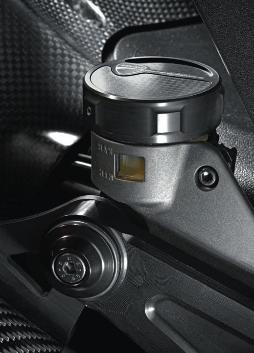 3 - Brake/clutch fluid reservoir cover Made from carbon fiber and billet