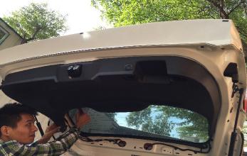 Use a moulding remover to carefully pry on the lift gate interior cover panel.