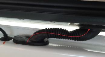 17. Using a wire puller or fish tape, pull the wiring harness through the factory wiring boot into the liftgate