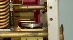 Tighten the lock nut against the adjusting nut, then verify that the cage height is still within range. Fig. 26 DTA to Trip Finger Gap. D. Return the Breaker to the OPEN position. CAGE HEIGHT 0.