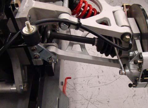 Verify park brake cables are routed in front of rubber body mounts and secured to upper A-arms on both sides. 2. See Fig. 2. Verify cables are secured to balance as shown. 3.