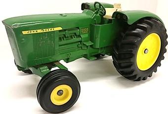 #228 $ Ertl 1/16 Toy Tractor Times JD 720 with 1994 imprint & die-cast wheels.