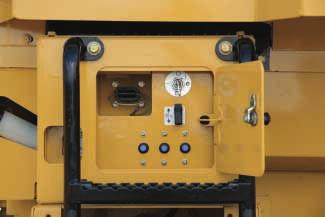 A lockable compartment located just below the left side access platform contains key electrical components such as the remote jump-start receptacle, battery disconnect switch, circuit breakers and