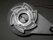 Loosen the nut on the motor housing by turning it counterclockwise (as viewed from the bottom of the motor).