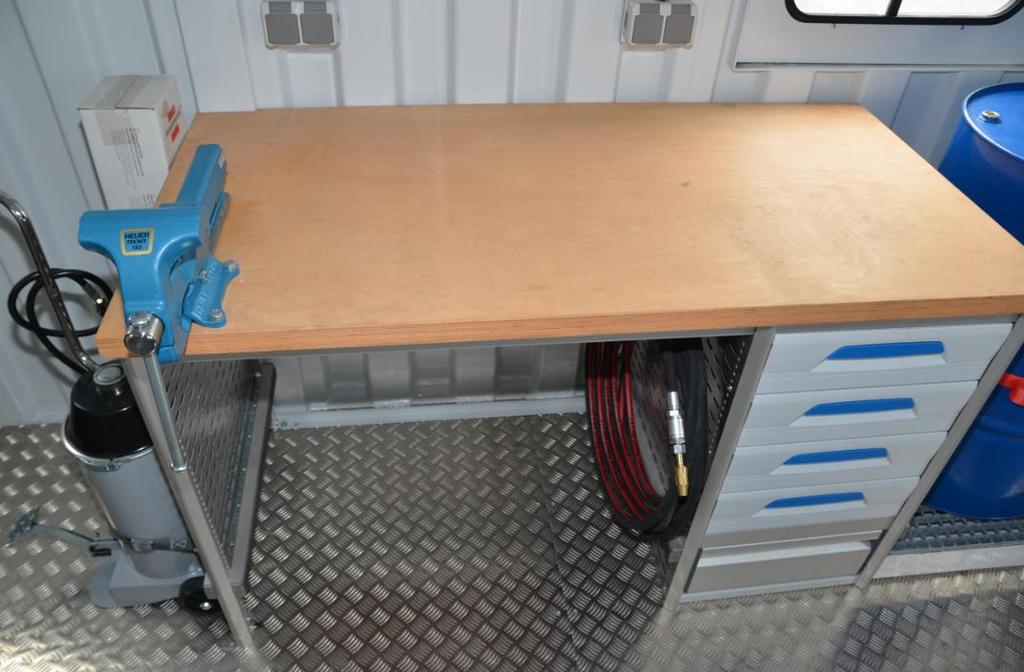 Workbench with solid forged steel parallel vice and drawer rack.