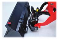 Auxiliary Ports Conveniently located on the rear of the attachment quick coupler, flat face, no drip couplers