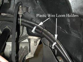 Install the black split loom (part #27) over the positive cable from where it exits the fiberglass.