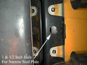 From underneath the rear of car, remove the two center fasteners that hold the fascia to rear metal bumper.