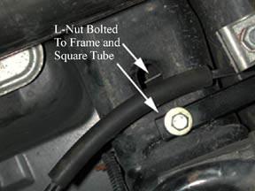 Reinstall the square tube member, but do not tighten it. Locate the two black L nuts (part #19). These will go in the slots on the frame rails.