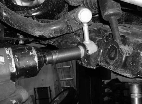 Also, move back the outer tie rod ball joint nut and remove completely. Remove the upper control arm and the outer tie rod from the knuckle. Let the knuckle hang.
