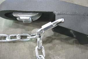 Securely fasten the hitch to the ball by tightening the hitch nut. Attach the safety chains as pictured below.