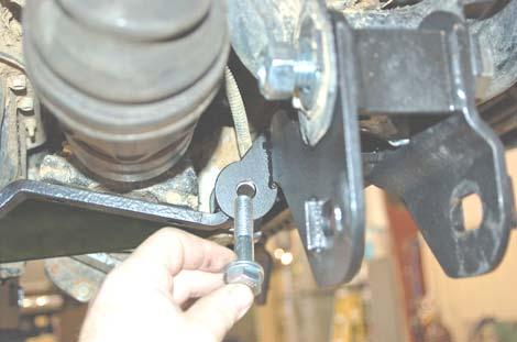 Insert the bushings and sleeves from 1770bag3 into the passenger diff bracket, as shown in PHOTO 24.
