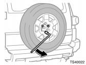 When storing the spare tire, put it in place and secure it to prevent it from flying forward during a collision or sudden braking. 2.