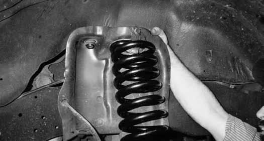 11. Place new BDS Coil Spring (4" or 6" lift coil spring) onto spring seat and secure with OEM fasteners. Raise assembly into the upper spring tower and secure with the OEM clip. [Fig. 7] Fig 7 12.