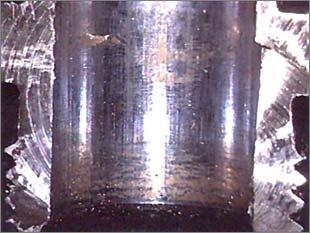 of the original coating exposing metal to gaseous ammonia.