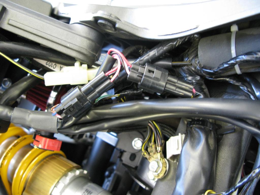 Connect the Bazzaz fuel harness to the control unit and route the remainder of the harness inside the left frame rail into the engine compartment.