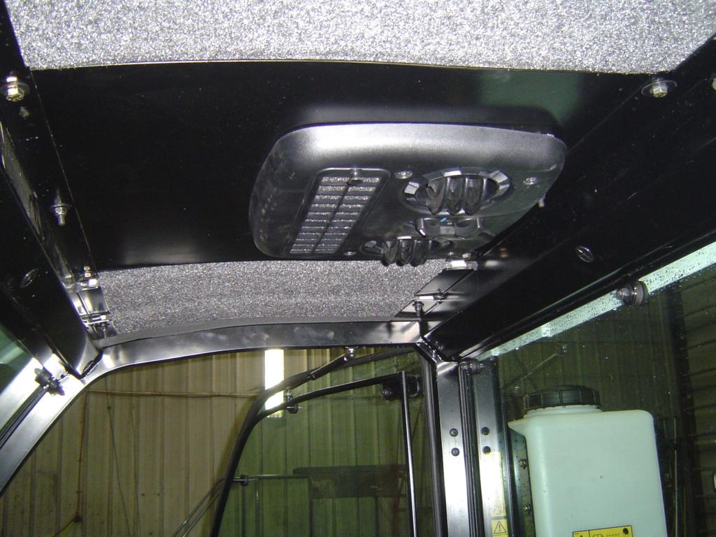 E. Air Diffuser Plenum 1) Install headliner. Photo 22 2) Install four M5 x 75 screws in the plenum assembly and secure with retainers provided. 3) Place one foam gasket in plastic plenum assembly.