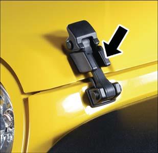 Four Door - If the soft top is removed, ensure that the pivot bracket strap is installed onto the Soft Top pivot bracket before removing the soft top from the vehicle.