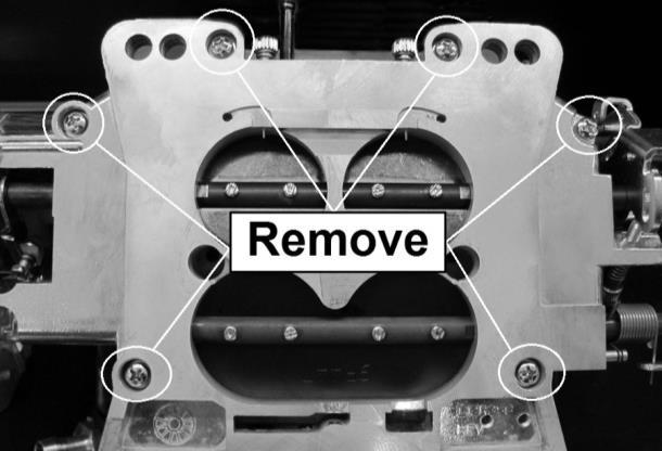Remove the six Phillips head screws from the bottom of the carburetor as