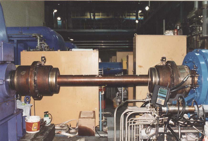 FIGURE 10. Gear coupling with spacer undergoing laser alignment. The coupling connects an electric motor driving a hammer mill.