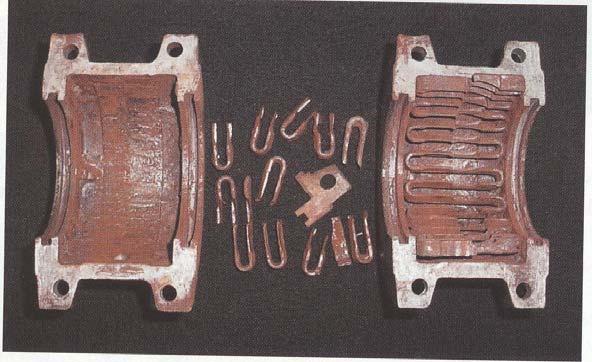 FIGURE 12. Courtesy American Axle & Manufacturing. Coupling shows failed serpentine spring and grease residue that had undergone oxidation.