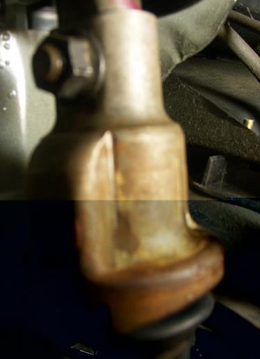 Remove single thru-bolt on steering column