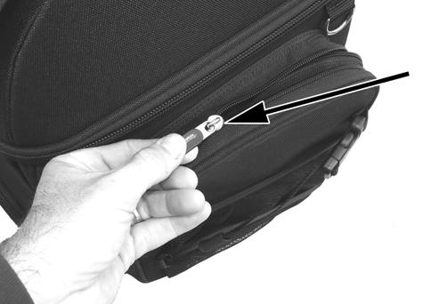 You only need to use one of the two zippers to close the side storage pocket. There is an elastic storage sleeve on the inside of each side storage pocket.
