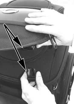 SECURING APPAREL UNDER THE UPPER STORAGE COMPARTMENT LID: You can use the upper storage compartment lid to hold a jacket or another piece of apparel