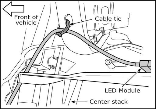 14. INSTALLATION 22. Feed the driver side LED module through behind the center stack to the driver side footwell. Fig. 23 23.