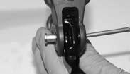 Rotate the lever and cam assembly toward the handlebar clamp.