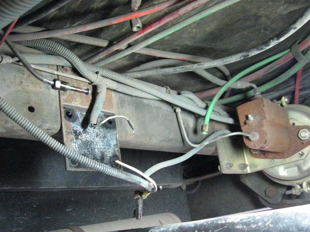 Remove 4 bolts holding the assembly from the frame member and remove the master cylinder assembly.