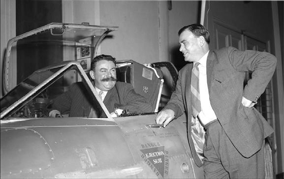 Bernard Lynch (left) and J.O. Lancaster (first live ejectee) with the cockpit section of EE416 presented to the Science Museum in London.
