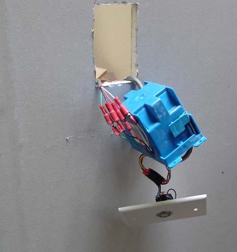 The interlocks have a cable with 4 connectors that attaches to a cable hanging from the call station. Run the wire through the wall to the call station.