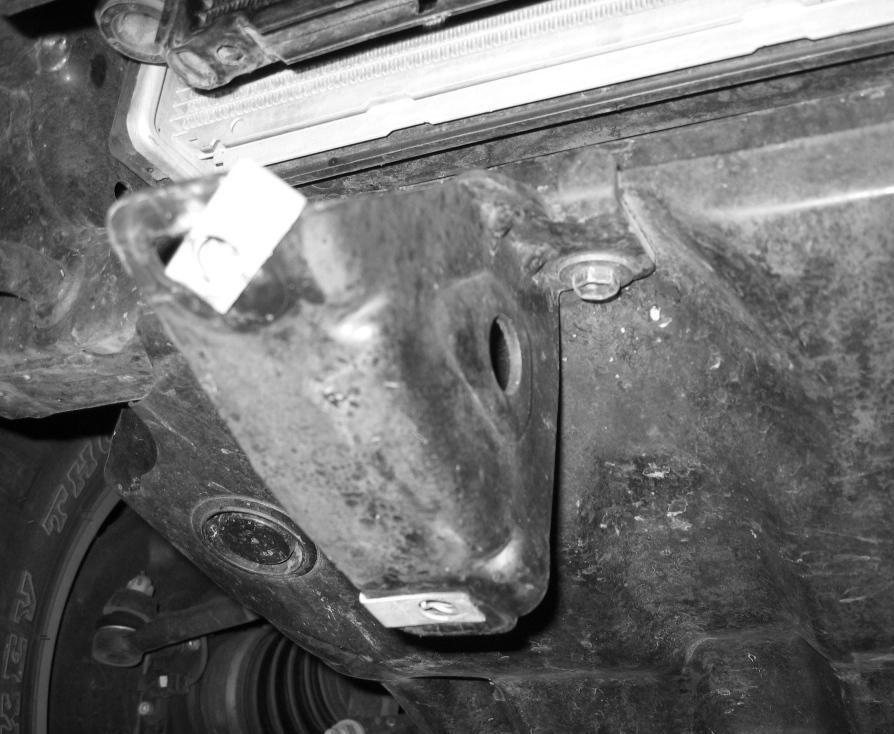8. Remove the lower OEM skid plate, along with aluminum skid plate front mounts.
