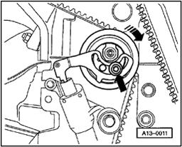 Page 24 of 35 15-24 - Using Torx wrench T45, loosen toothed belt tensioner (lower arrow). - Push down on toothed belt tensioner. - Remove toothed belt from camshaft gear.