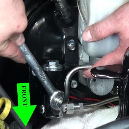 STEP 9. Our Recommended Installation Procedure: Thread the Summit Racing Roll Stop brake line into the OEM front brake line by hand and leave loose at this point.