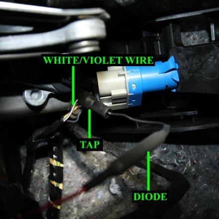 Using the included T-tap connector, tap the black wire side of provided diode into the violet/white wire of the brake pedal switch.