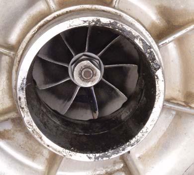 ) coming in contact with the blades while they were spinning. Dirt Ingestion: Also called dusting. The compressor wheel blades show signs of erosion from dirt entering the intake air system.