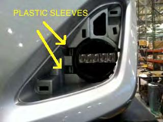 Remove lower splash shields on both sides and then fog light cover plates 22.
