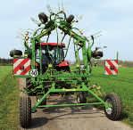 small tractors running on a separate chassis that is fit for road travel and that hitches to tractor link arms,