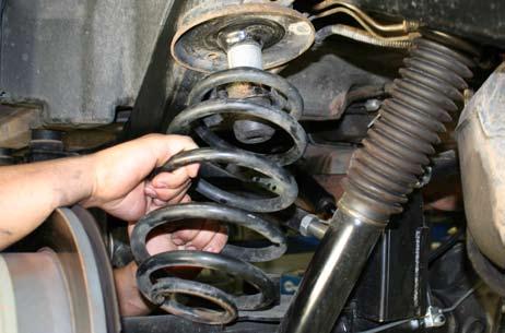 remove the shock bolts at the axle side using an 15mm and