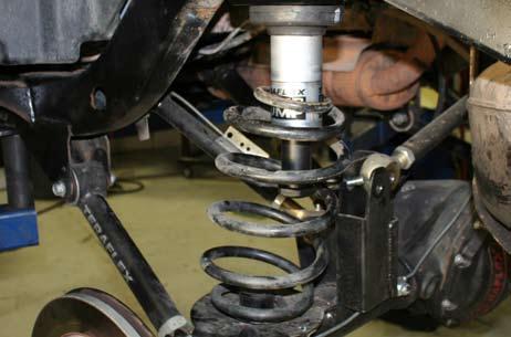 Reinstall the shocks, sway bar links and track bar if they were removed. 30. 31. 32. Install the new coil spring isolator.
