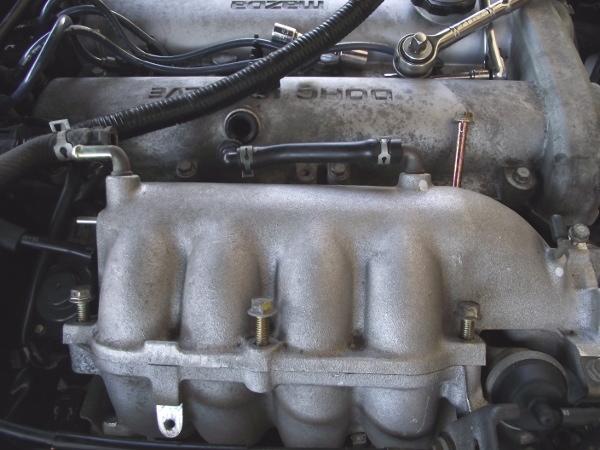 3. Remove the bolts holding the plenum to the intake manifold.