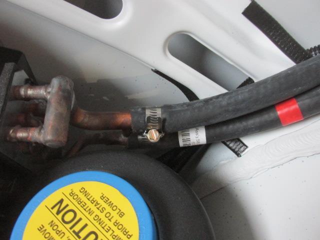 7. Attach the two (2) heater hoses to the heating ports.