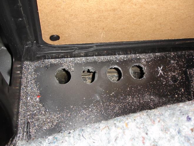 passenger compartment to the underside of the vehicle. Install grommets (02 000 053) in the holes.