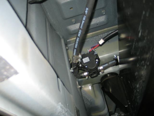 REAR COMPARTMENT TO MID-BODY INSTALLATION 17. With the four (4) hoses and Evaporator harness now under the vehicle, determine a path to the engine compartment.