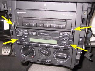 at the same time pulling back on the radio to slide it out of it's DIN slot. Once it's out, disconnect the power, speaker and antenna connections behind the radio. 52.