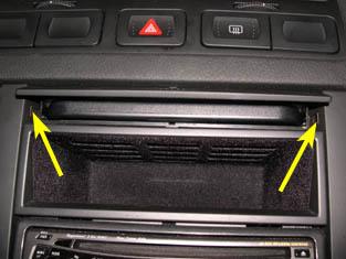 To do this, push on the flap to release the cupholder, push the cuphloder back in but don't fold the flap down, as shown below.