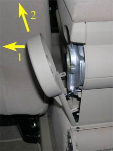First pull the top of the trim towards the driver's side (1) and